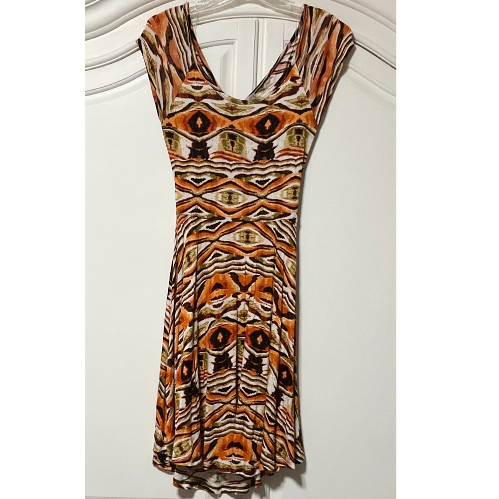 TeenBell Junior teen Med print dress, cutout at waist in back with cross over